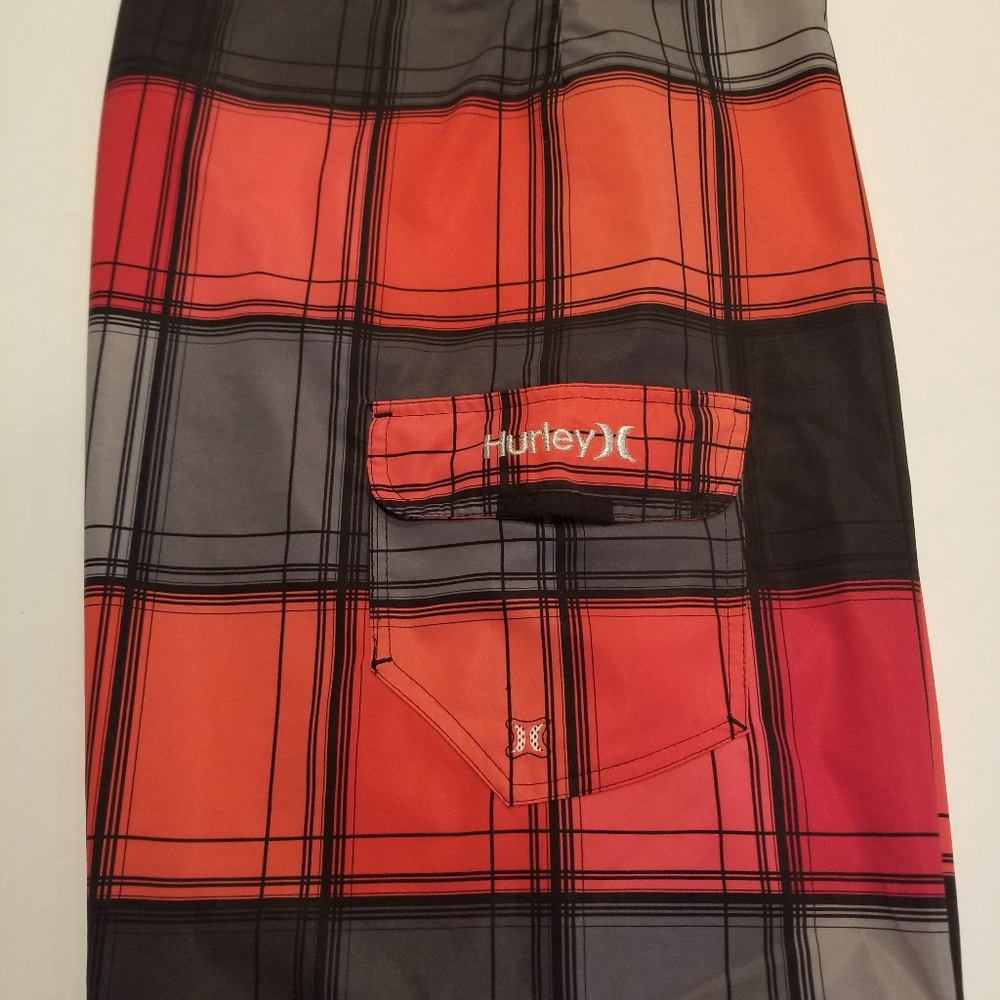 Hurley boardshorts.     Size.34, Red/Black checkerboard theme.